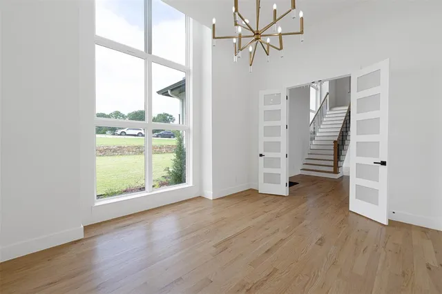 a bathroom with a toilet a sink a mirror and vanity