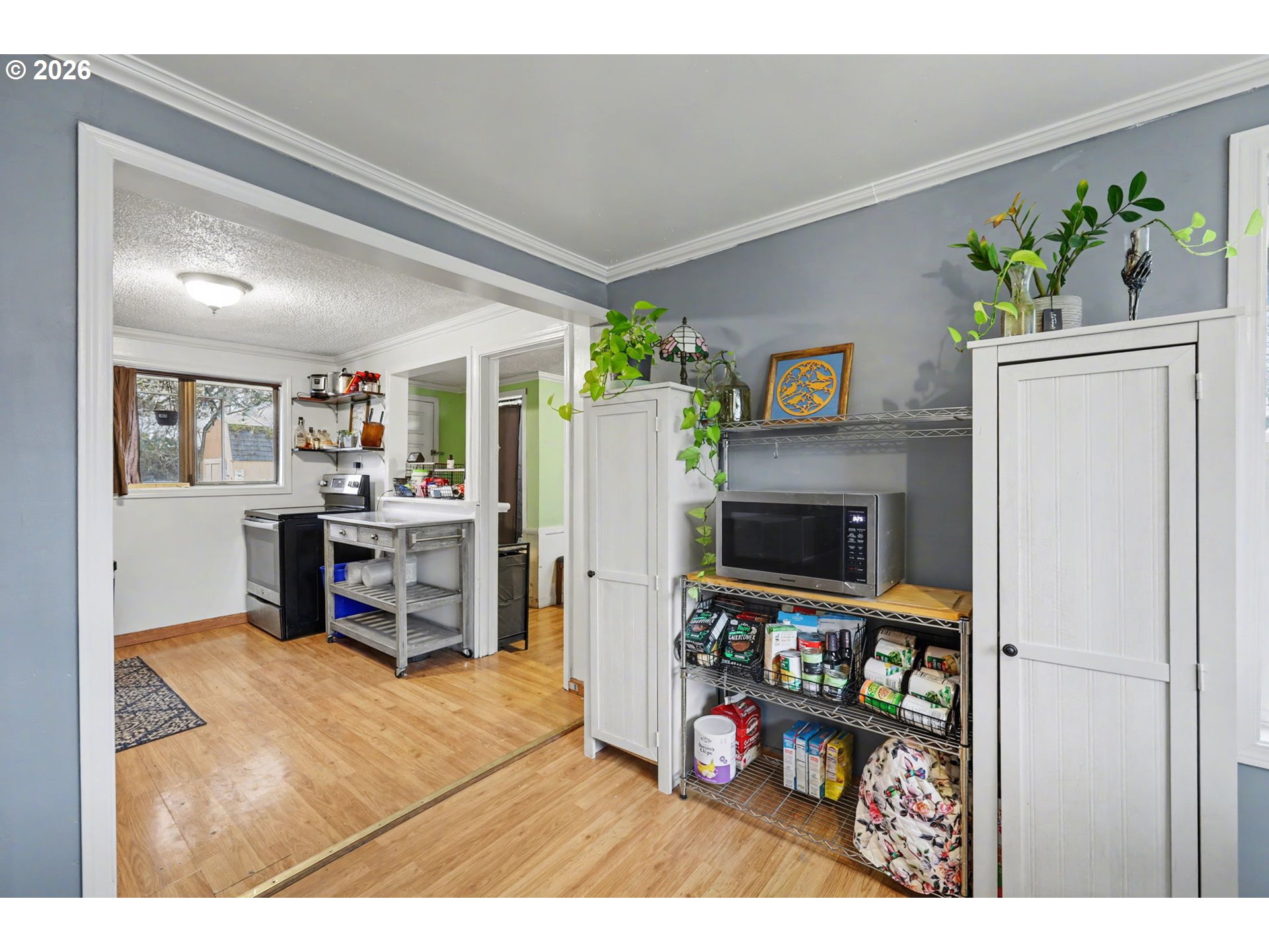 1891 Scott Road Springfield, OR 97477 - Photo 11 of 38 a living room with furniture a flat screen tv and a dining table