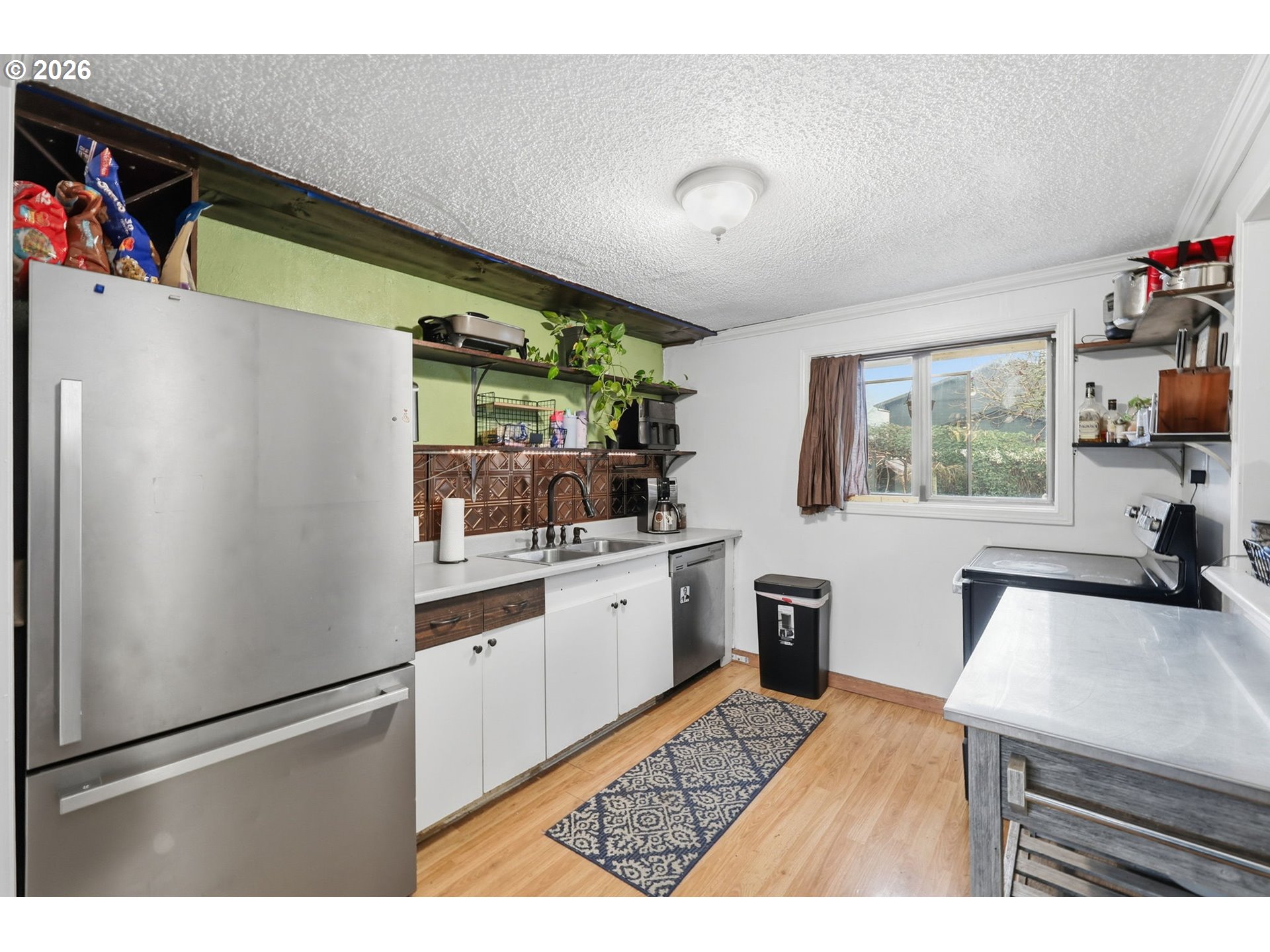 1891 Scott Road Springfield, OR 97477 - Photo 15 of 38 a kitchen with a refrigerator and a sink