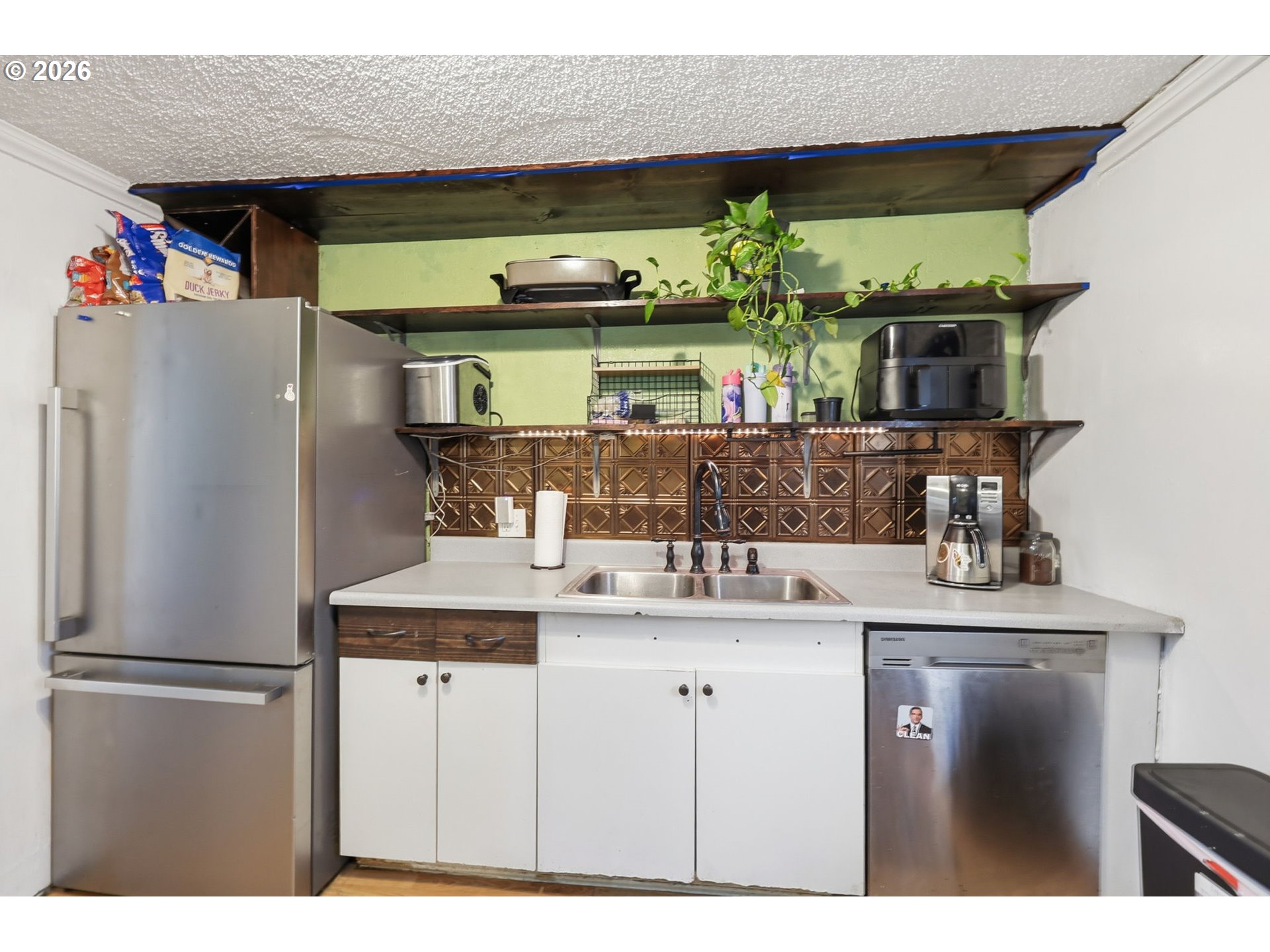 1891 Scott Road Springfield, OR 97477 - Photo 19 of 38 a kitchen with stainless steel appliances granite countertop a sink and a refrigerator