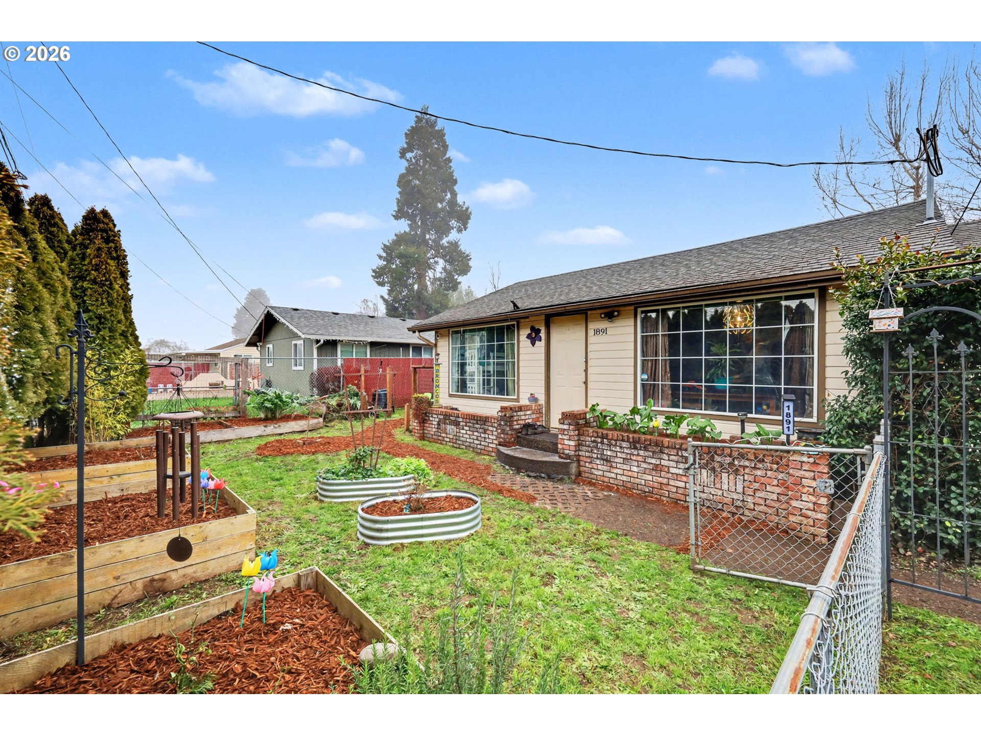 1891 Scott Road Springfield, OR 97477 - Photo 2 of 38 a view of an house with backyard tub and fire pit