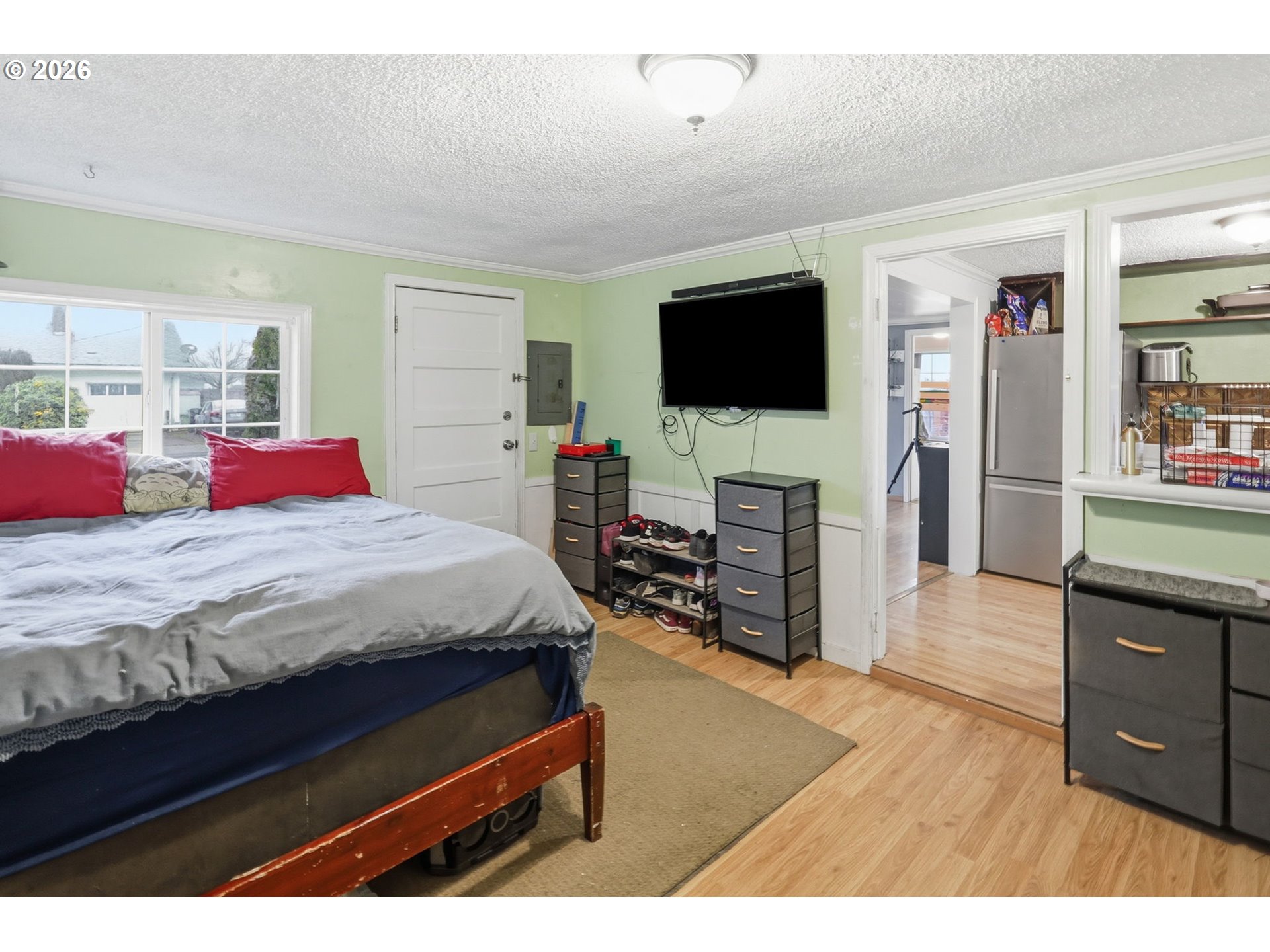 1891 Scott Road Springfield, OR 97477 - Photo 28 of 38 a bedroom with a bed and a flat screen tv