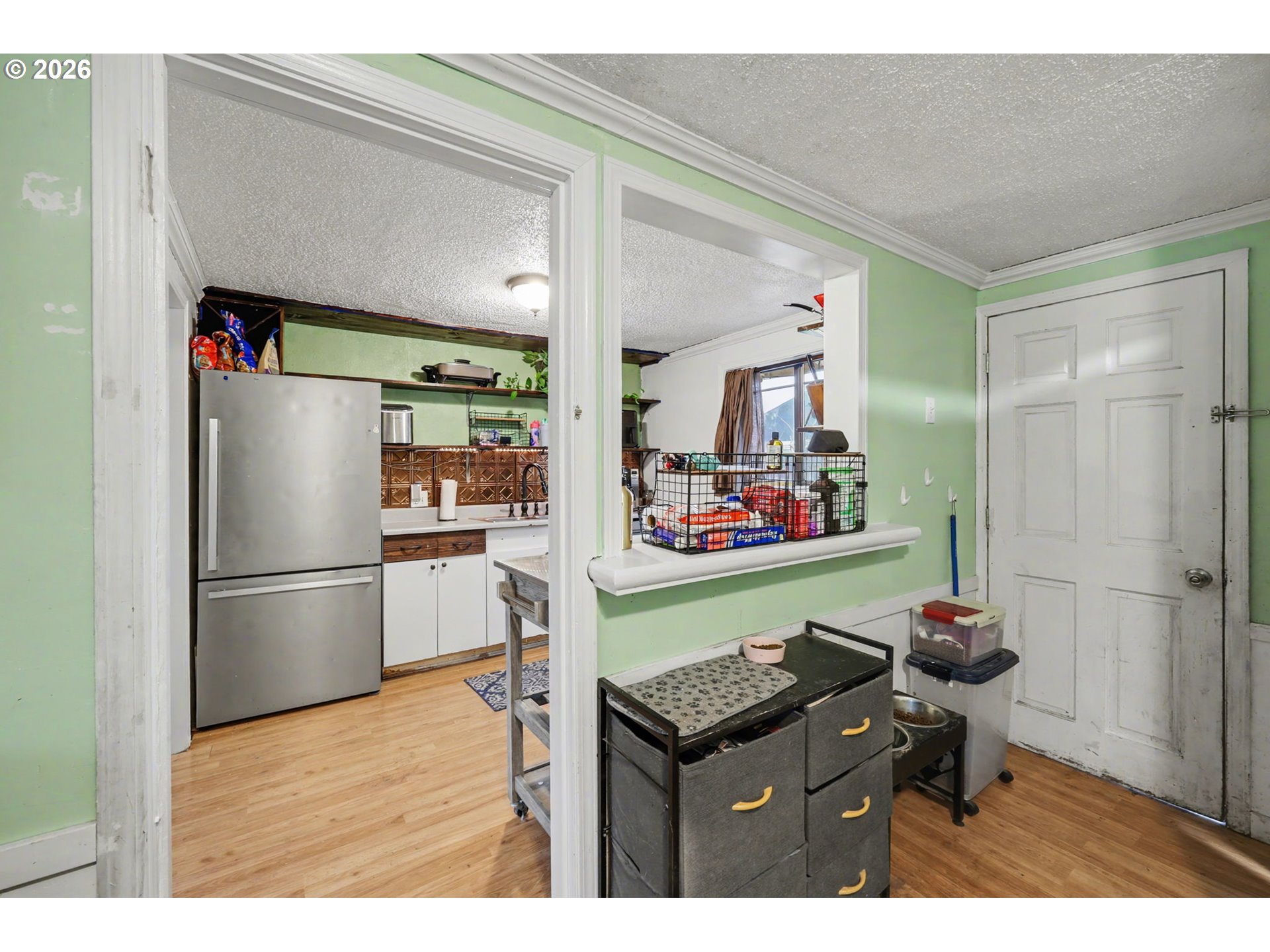 1891 Scott Road Springfield, OR 97477 - Photo 30 of 38 a kitchen with refrigerator and cabinets