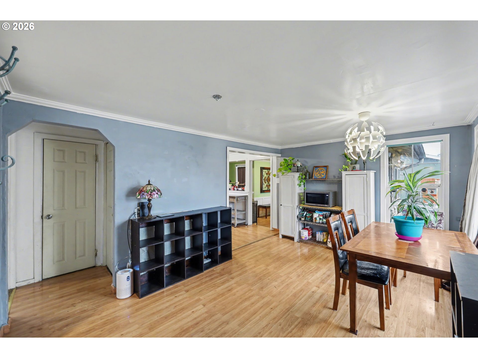 1891 Scott Road Springfield, OR 97477 - Photo 8 of 38 a living room with furniture a dining table and a chandelier