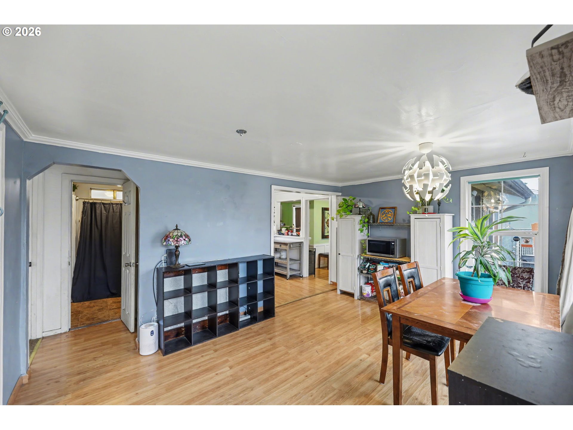 1891 Scott Road Springfield, OR 97477 - Photo 9 of 38 a living room with furniture a chandelier and a flat screen tv