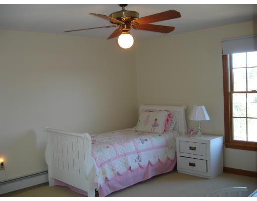 82 Whiley Road Groton, MA 01450 - Photo 23 of 30 a bedroom with a bed and a window