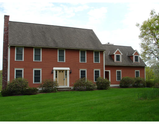 82 Whiley Road Groton, MA 01450 - Photo 25 of 30 a front view of a house with a garden
