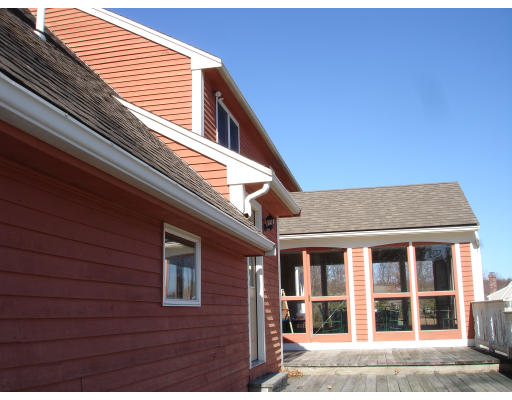 82 Whiley Road Groton, MA 01450 - Photo 4 of 30 a view of a brick house with a large window