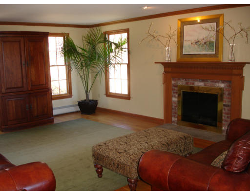 82 Whiley Road Groton, MA 01450 - Photo 6 of 30 a living room with furniture and a fireplace