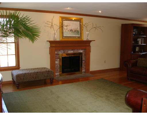 82 Whiley Road Groton, MA 01450 - Photo 7 of 30 a living room with furniture and a fireplace