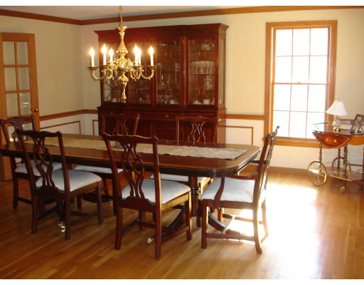 82 Whiley Road Groton, MA 01450 - Photo 10 of 30 a view of a dining room with furniture and chandelier