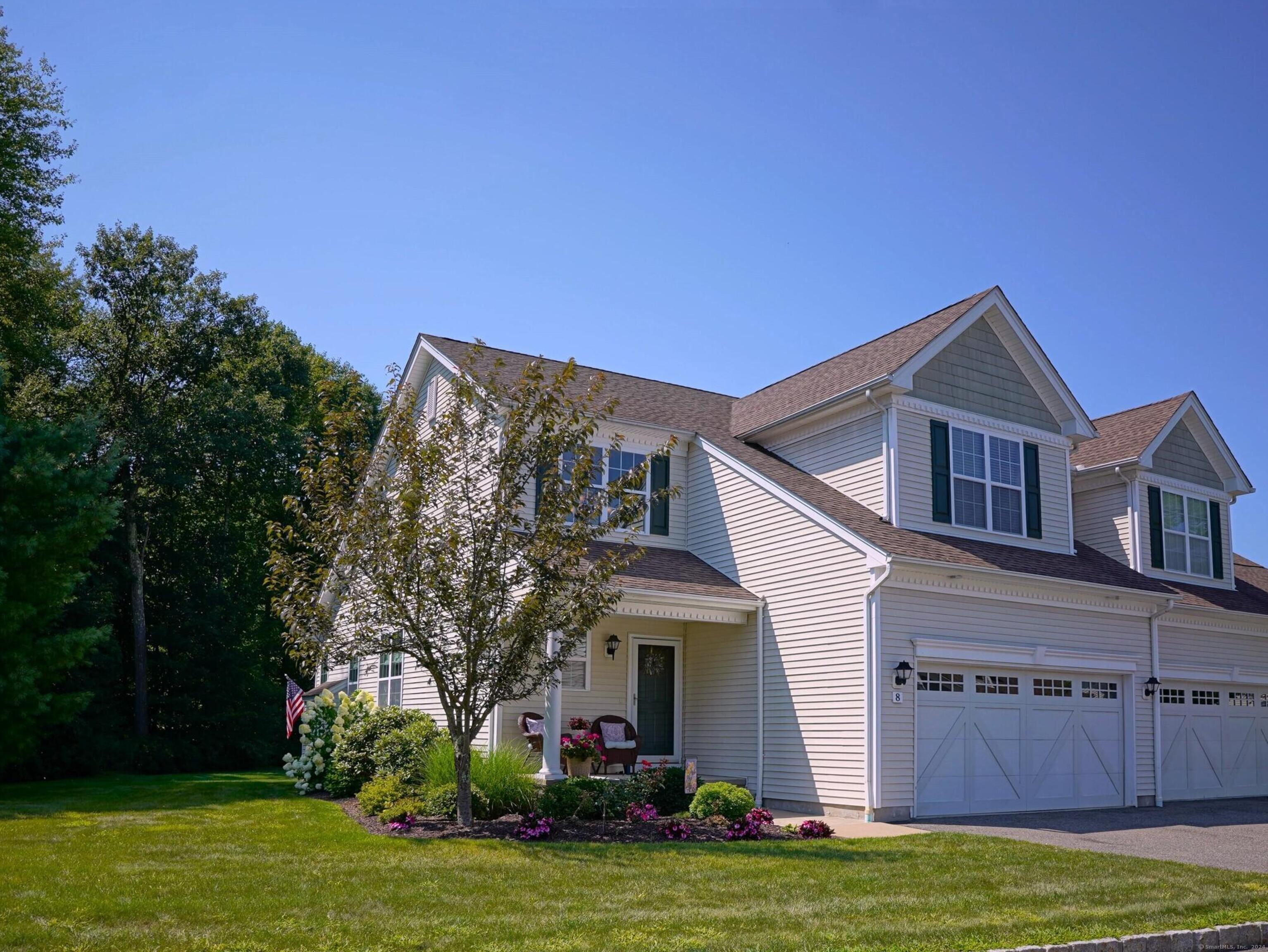 a view of a house with a swimming pool and a yard