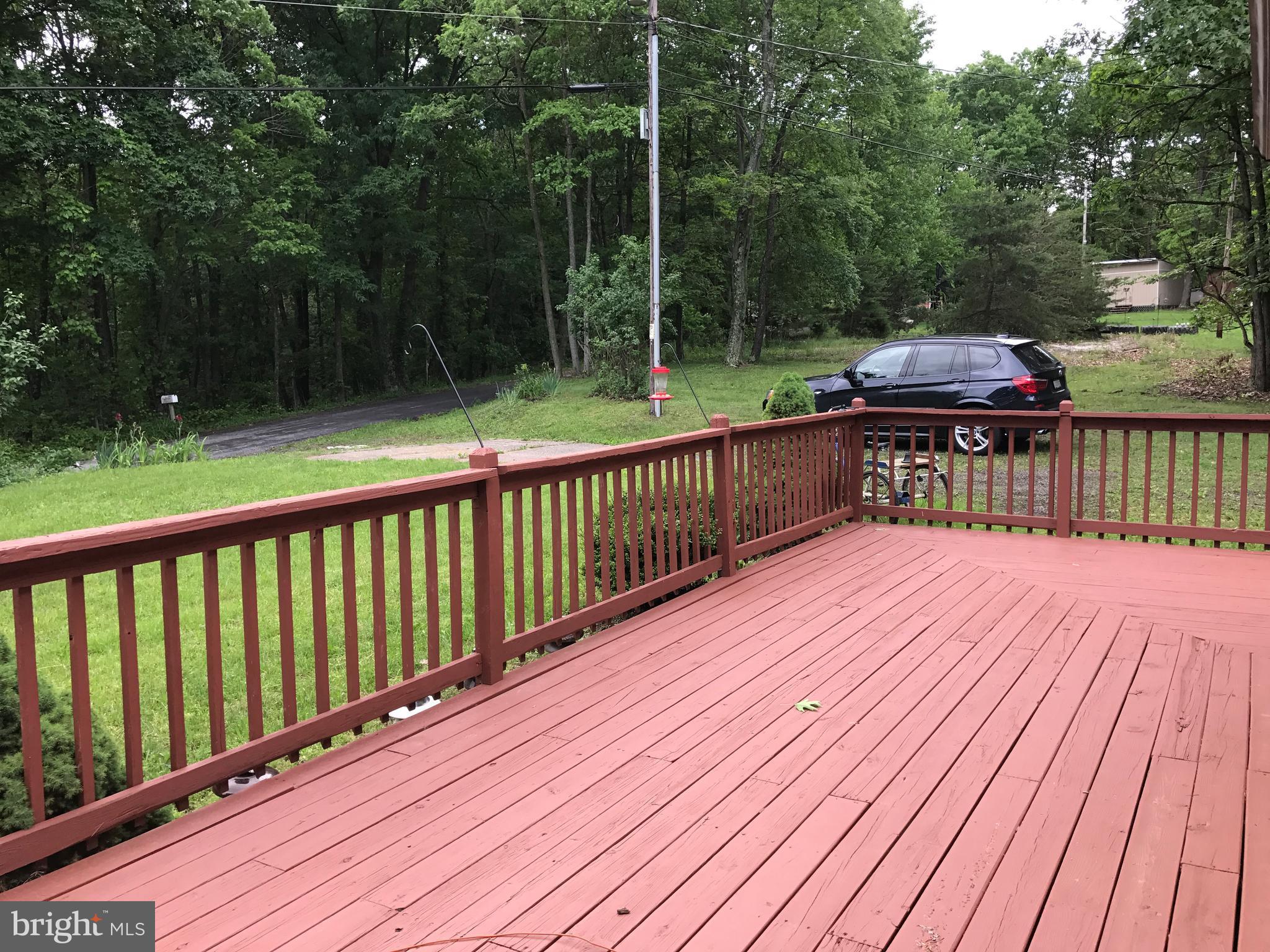 2846 Mauzy Road Berkeley Springs, WV 25411 - Photo 19 of 29 Wrap around deck that has been freshly painted.