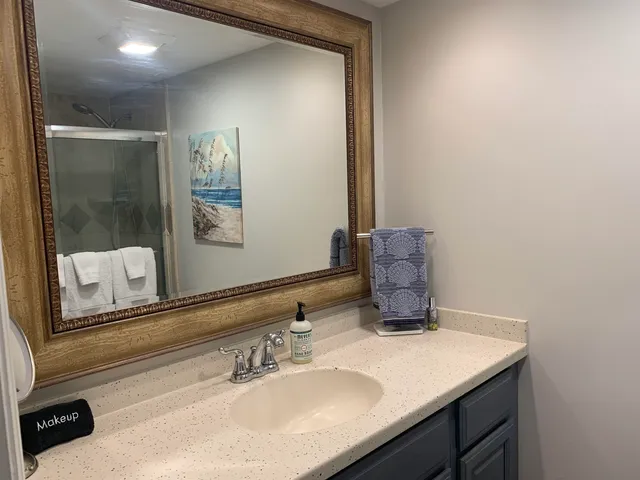 a bedroom with a large bed and a large window