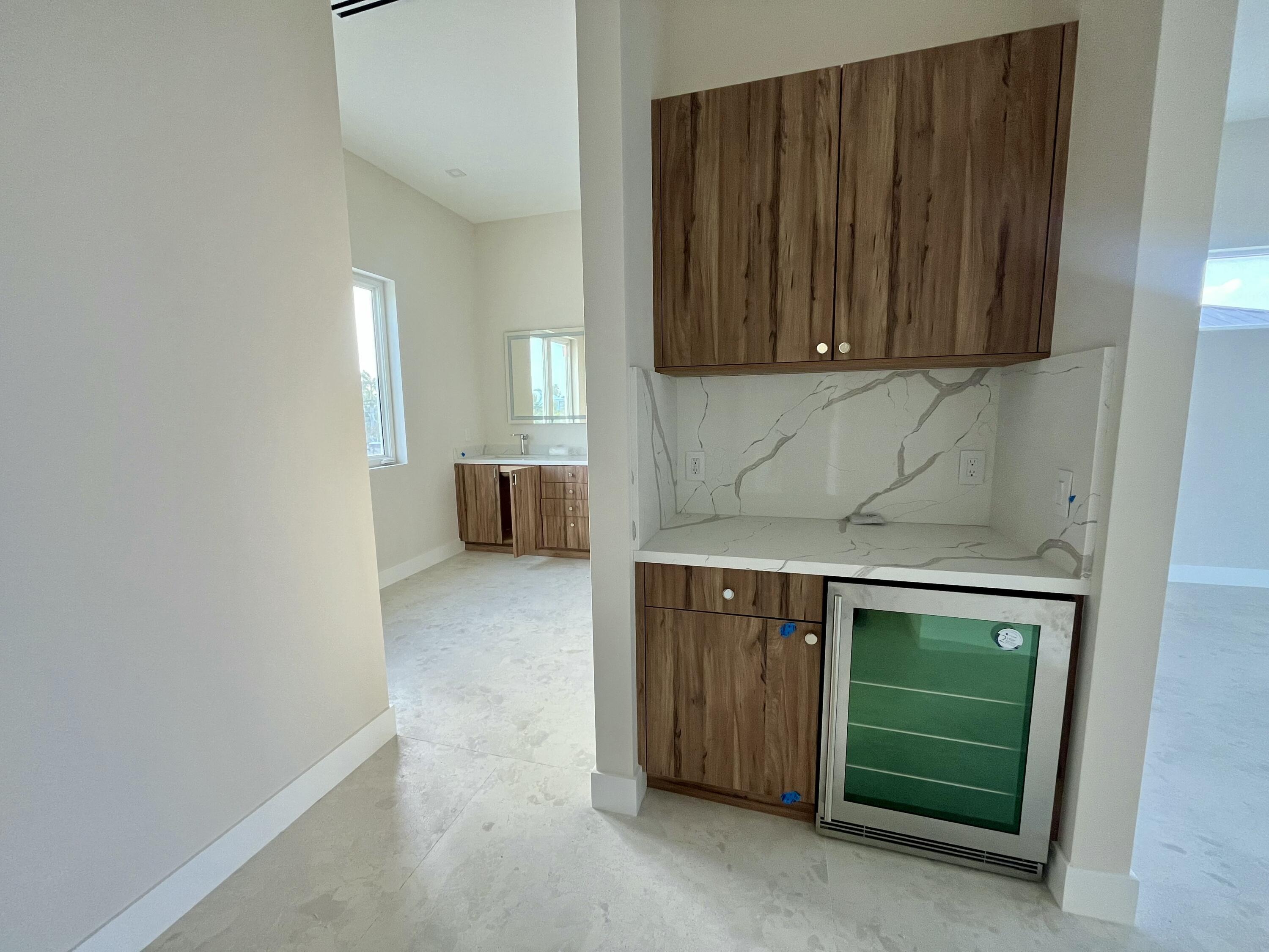 128 Sunrise Drive Marathon, FL 33050 - Photo 21 of 40 a kitchen with a sink and cabinets