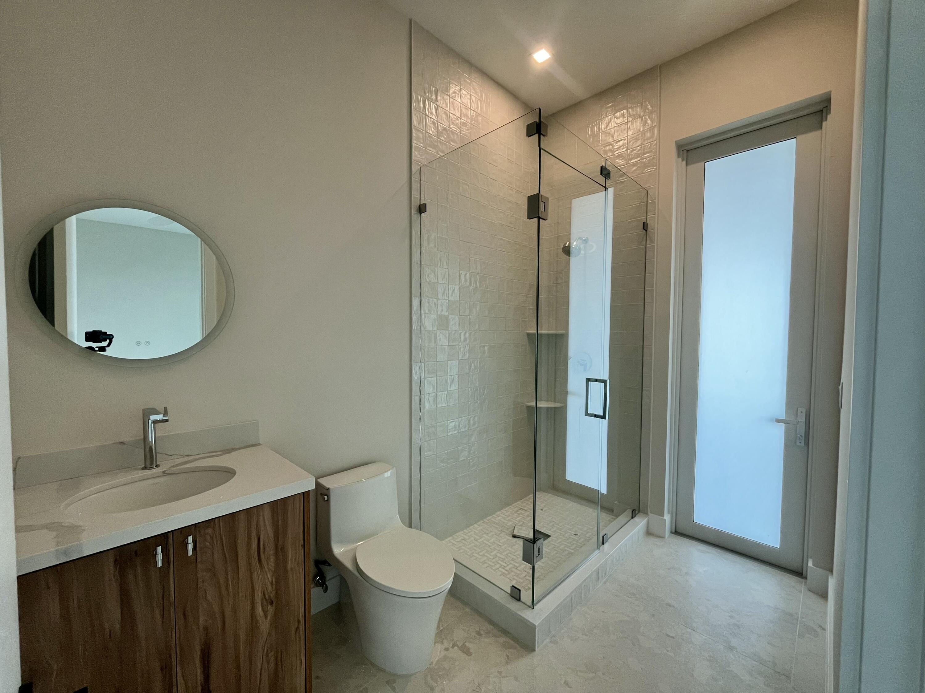 128 Sunrise Drive Marathon, FL 33050 - Photo 26 of 40 a bathroom with a sink and a mirror