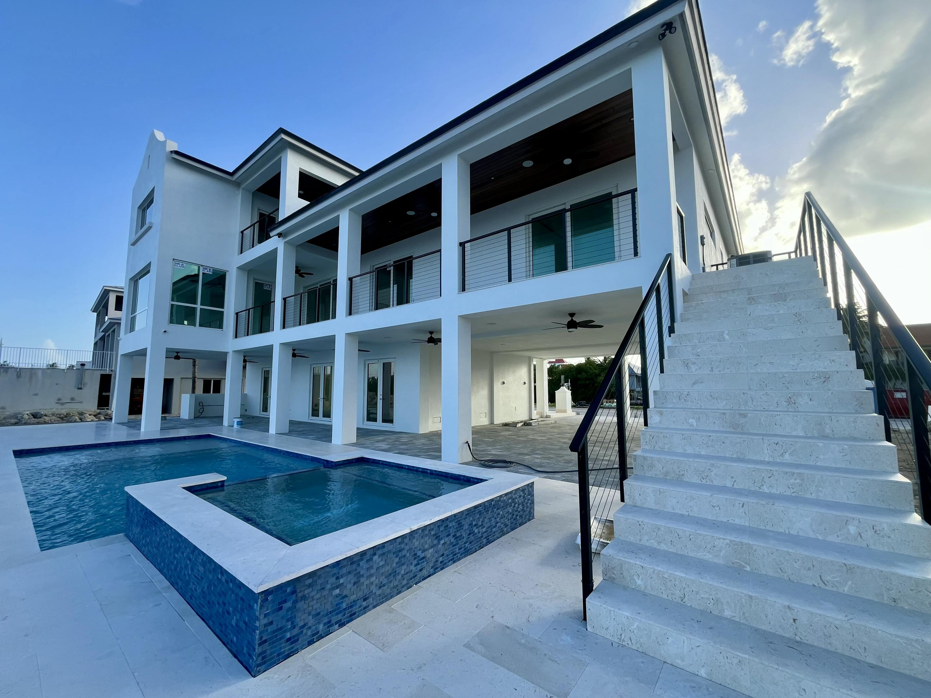 128 Sunrise Drive Marathon, FL 33050 - Photo 31 of 40 a view of living room kitchen with furniture and wooden floor
