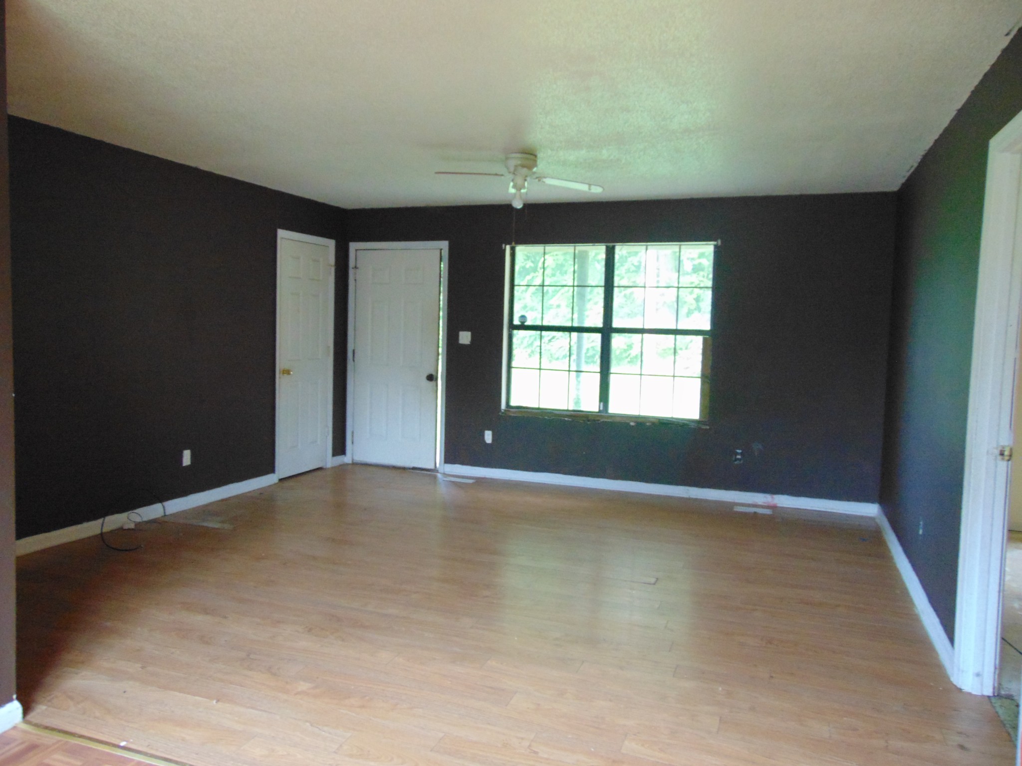 211 Wilson Street Winchester, TN 37398 - Photo 7 of 18 wooden floor in an empty room with a window