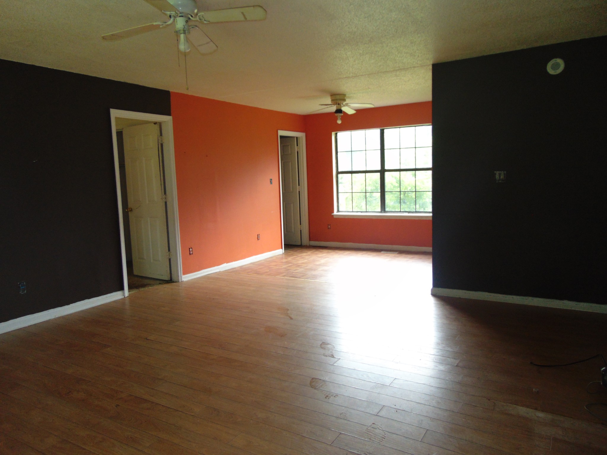 211 Wilson Street Winchester, TN 37398 - Photo 9 of 18 an empty room with wooden floor and windows