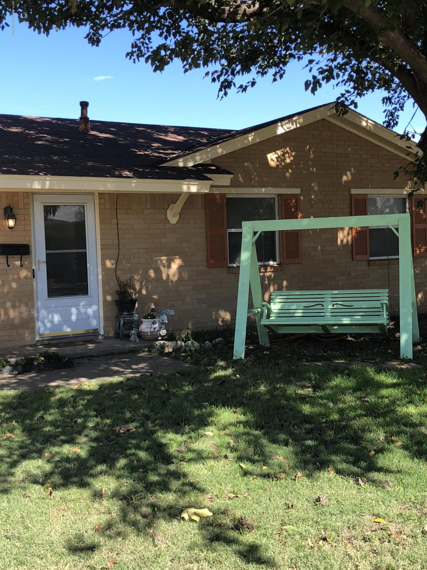 2406 Southwest 49th Avenue Amarillo, TX 79110 - Photo 2 of 38 a front view of a house with a yard