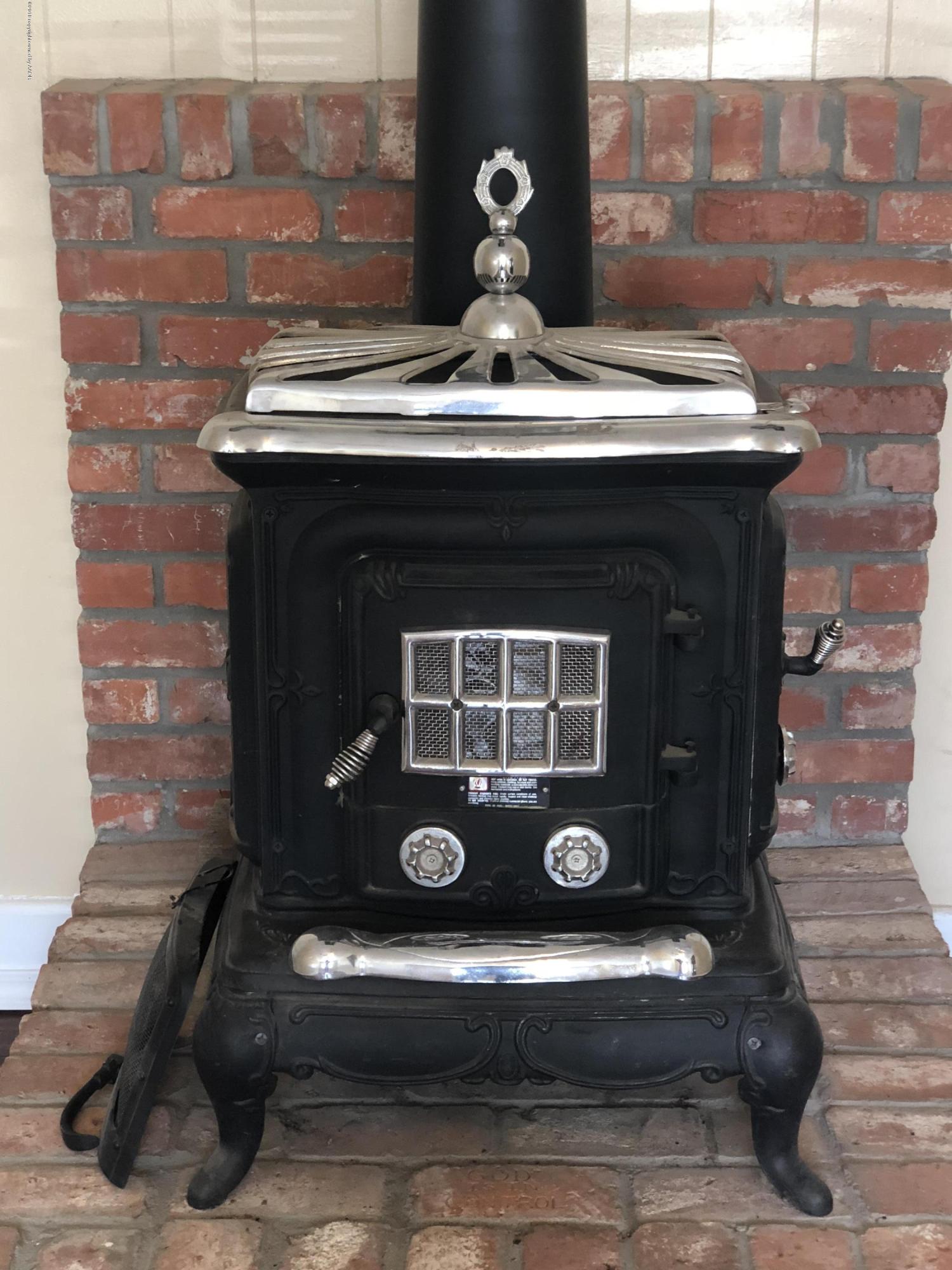 2406 Southwest 49th Avenue Amarillo, TX 79110 - Photo 13 of 38 a stove top oven sitting inside of a kitchen