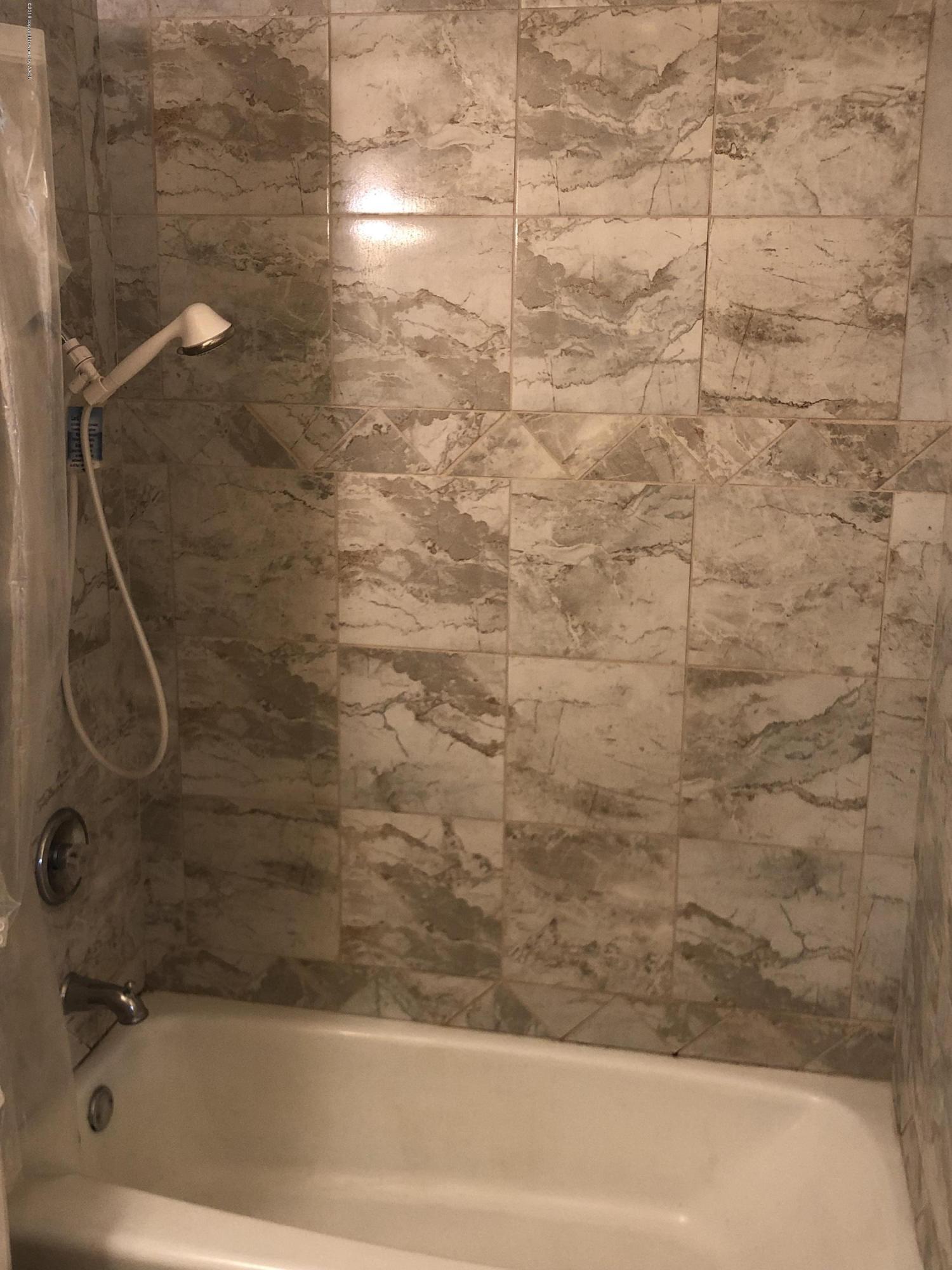 2406 Southwest 49th Avenue Amarillo, TX 79110 - Photo 19 of 38 a bathroom with a bathtub