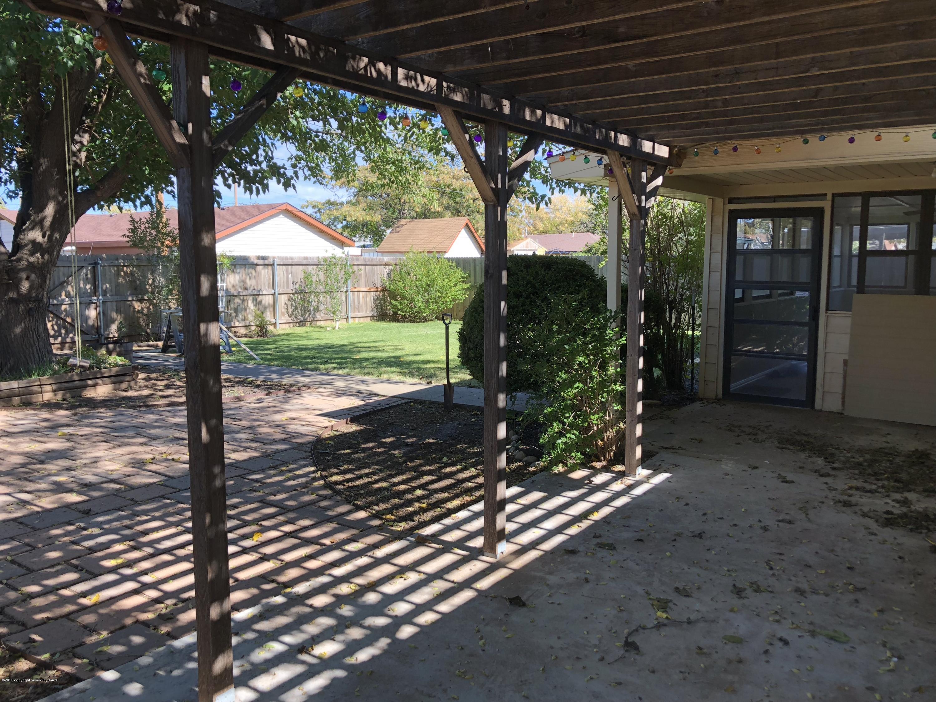 2406 Southwest 49th Avenue Amarillo, TX 79110 - Photo 37 of 38 a view of a porch with a backyard