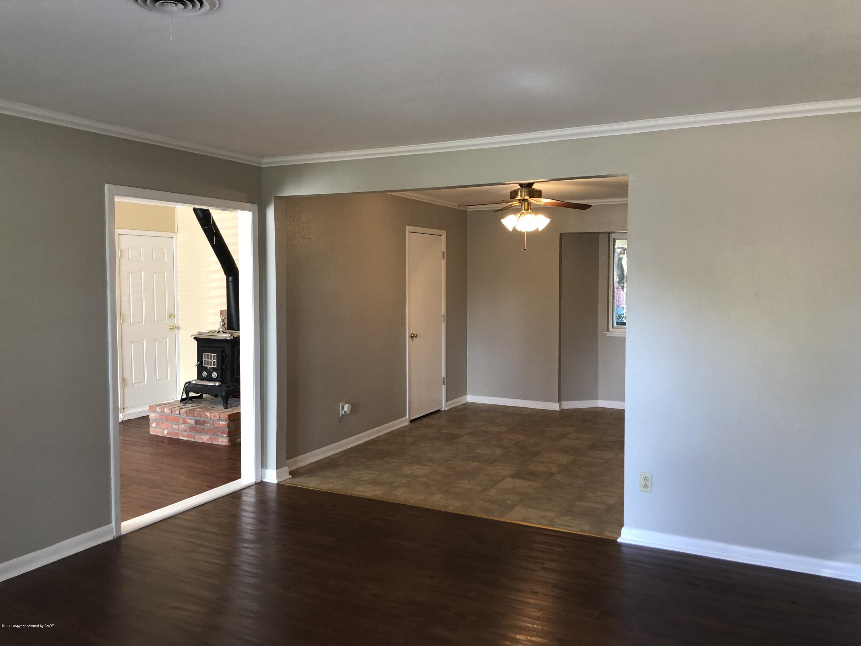 2406 Southwest 49th Avenue Amarillo, TX 79110 - Photo 5 of 38 a view of empty room with wooden floor
