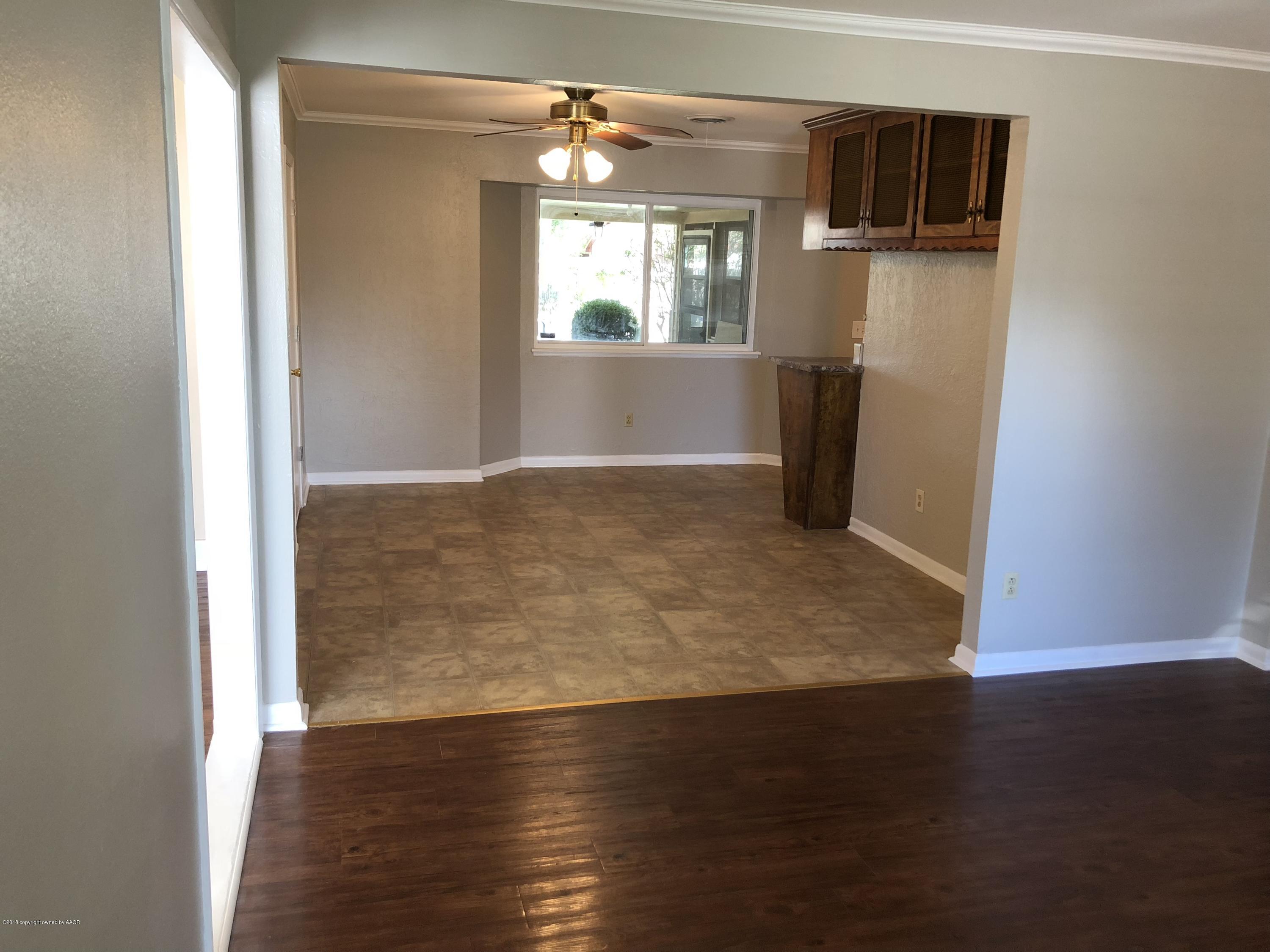 2406 Southwest 49th Avenue Amarillo, TX 79110 - Photo 6 of 38 a view of empty room with wooden floor and fan