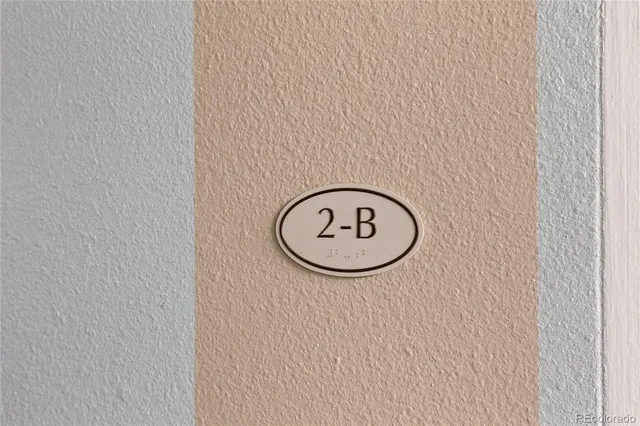 a room with lots of flowers and wooden floor