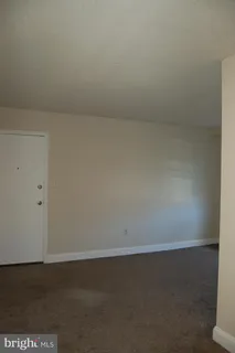 wooden floor and window in an empty room