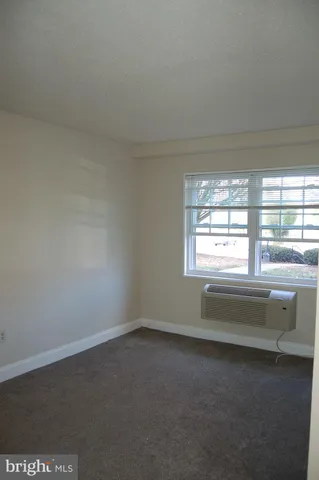 wooden floor and window in an empty room