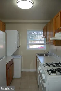 a white refrigerator freezer sitting in a kitchen