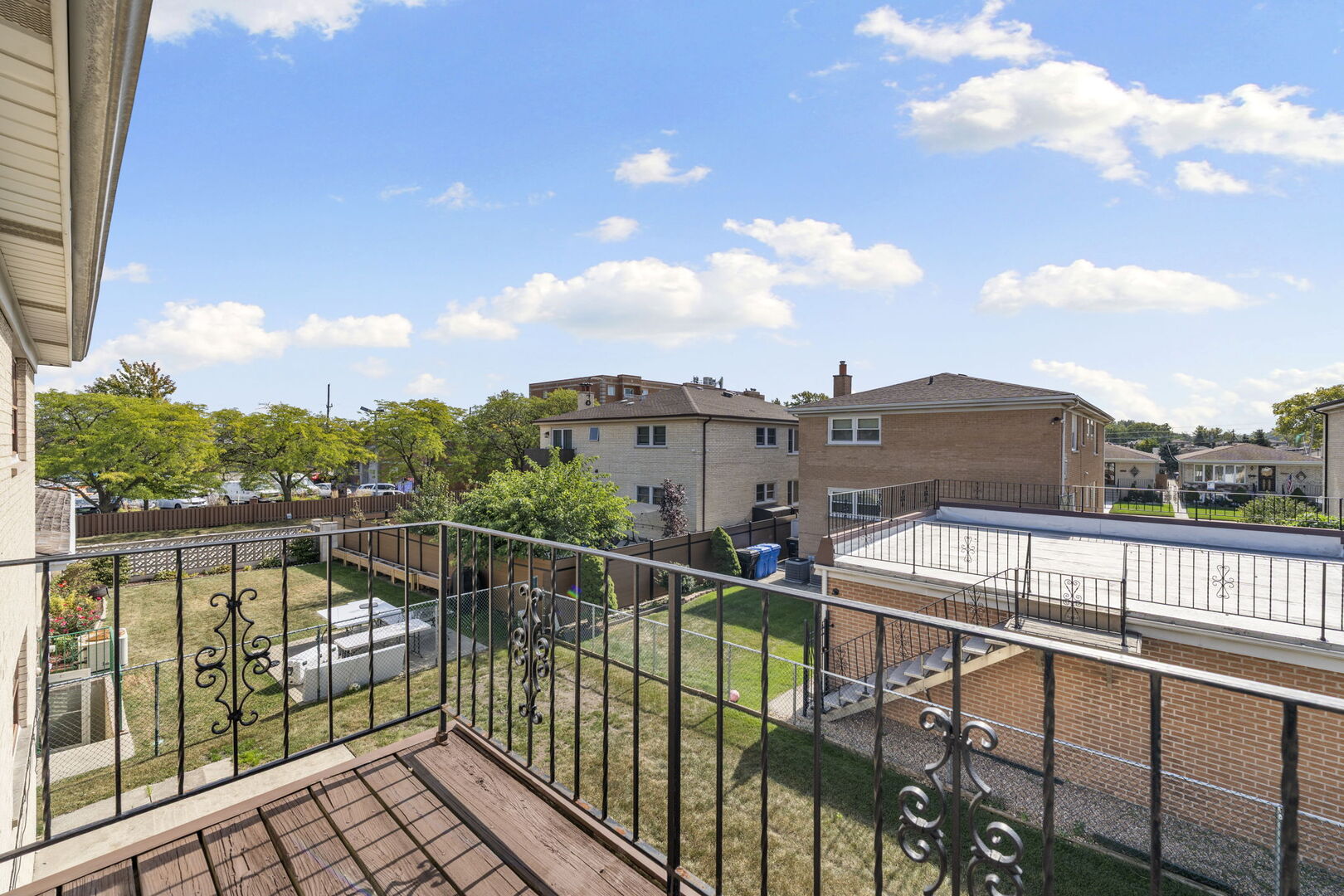 8427 West Windsor Avenue, Unit 2 Chicago, IL 60656 - Photo 18 of 37 a view of a balcony with wooden floor and fence