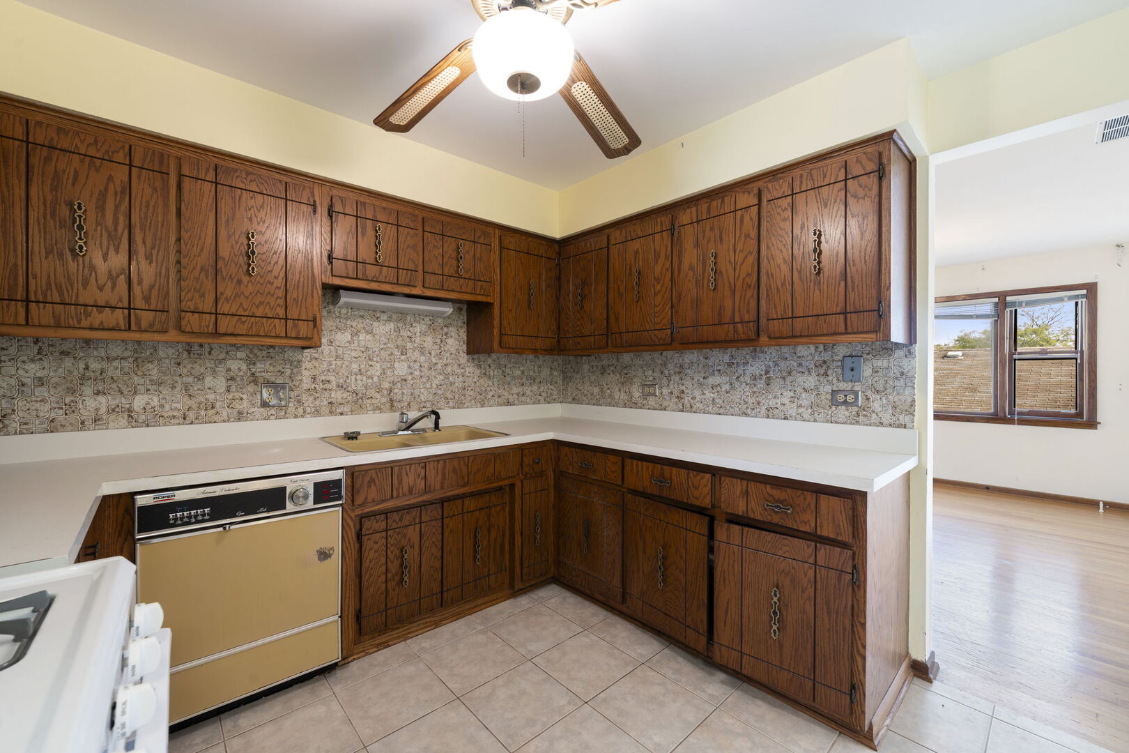 8427 West Windsor Avenue, Unit 2 Chicago, IL 60656 - Photo 9 of 37 a kitchen with a sink cabinets and window