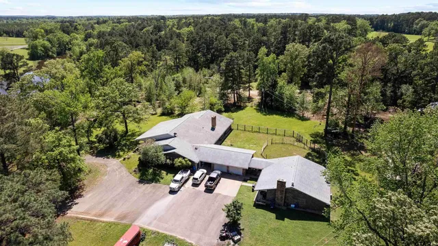 an aerial view of a house with a garden