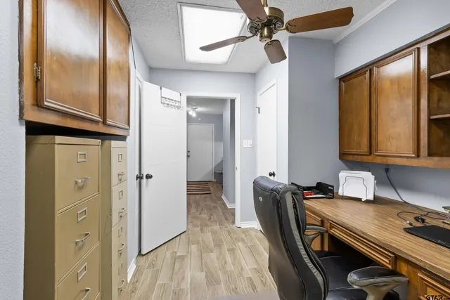 a kitchen with stainless steel appliances granite countertop a refrigerator a sink and dishwasher