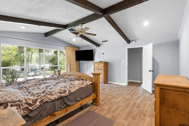 a bed sitting in a room next to a window