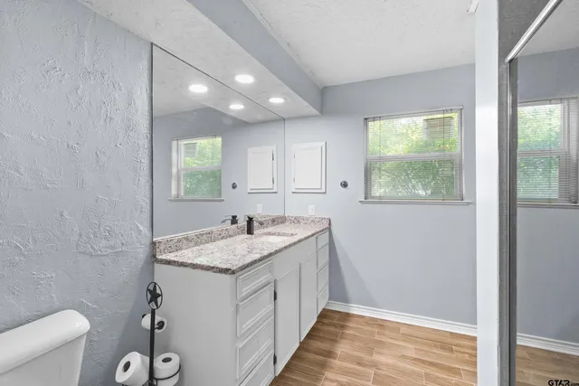 a swimming pool with outdoor seating and yard