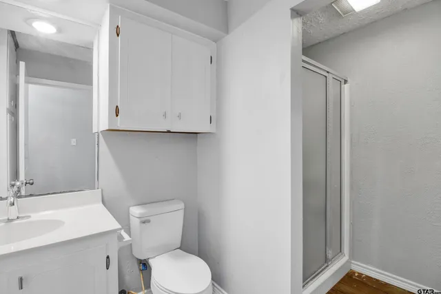 a red brick house with a yard