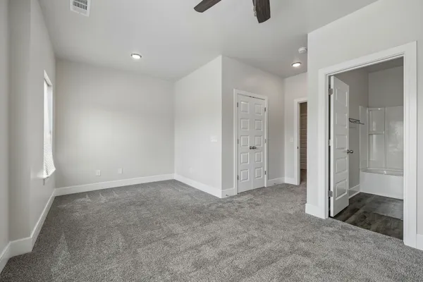 an empty room with closet area