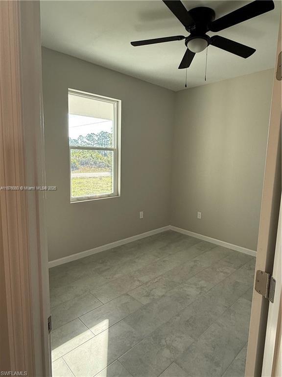 832 Holmes Avenue, Unit 832 Lehigh Acres, FL 33974 - Photo 24 of 24 a view of an empty room with a window