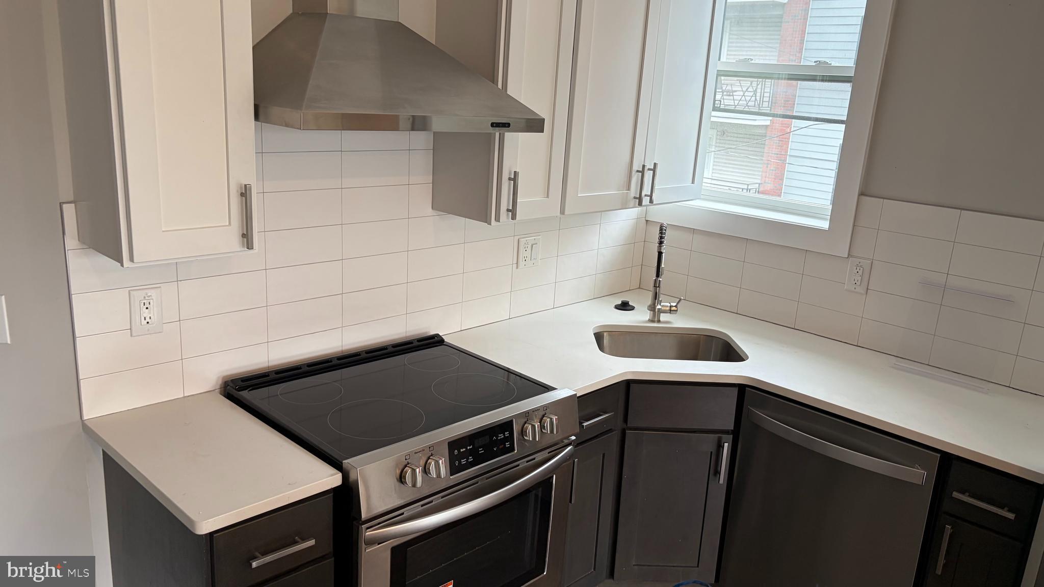 2001 North 33rd Street, Unit 2 Philadelphia, PA 19121 - Photo 7 of 26 a kitchen with a sink and cabinets