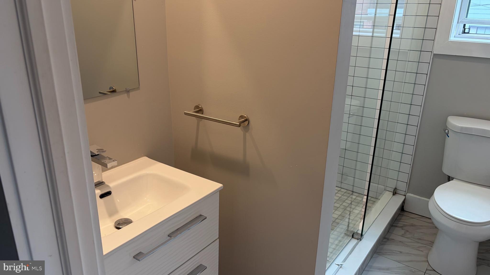 2001 North 33rd Street, Unit 2 Philadelphia, PA 19121 - Photo 9 of 26 a bathroom with a sink and toilet