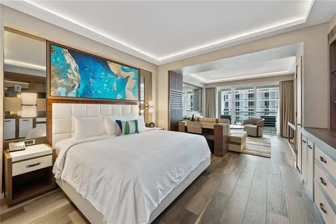 a bed room with a bed and a large window