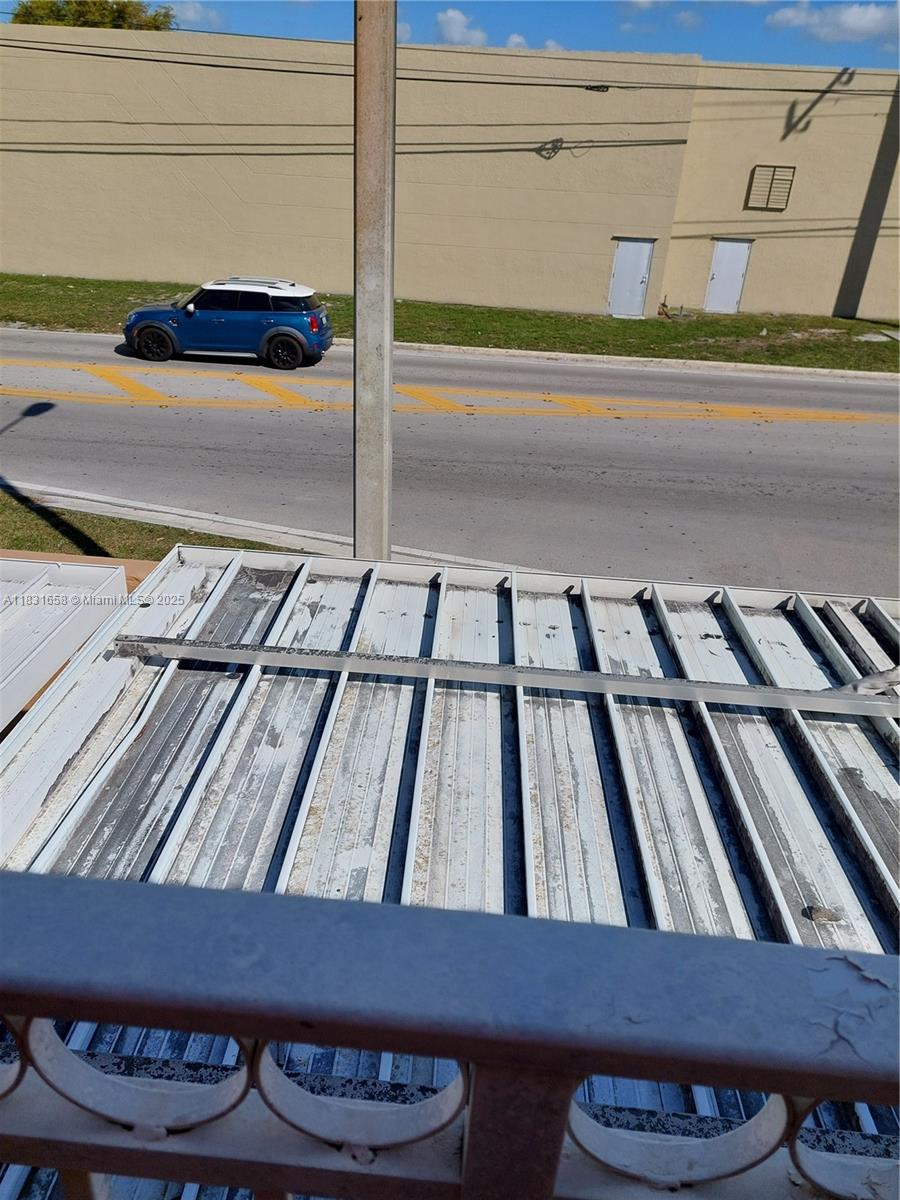 2403 West 76th Street, Unit 203 Hialeah, FL 33016 - Photo 11 of 13 a view of staircase with wooden floor
