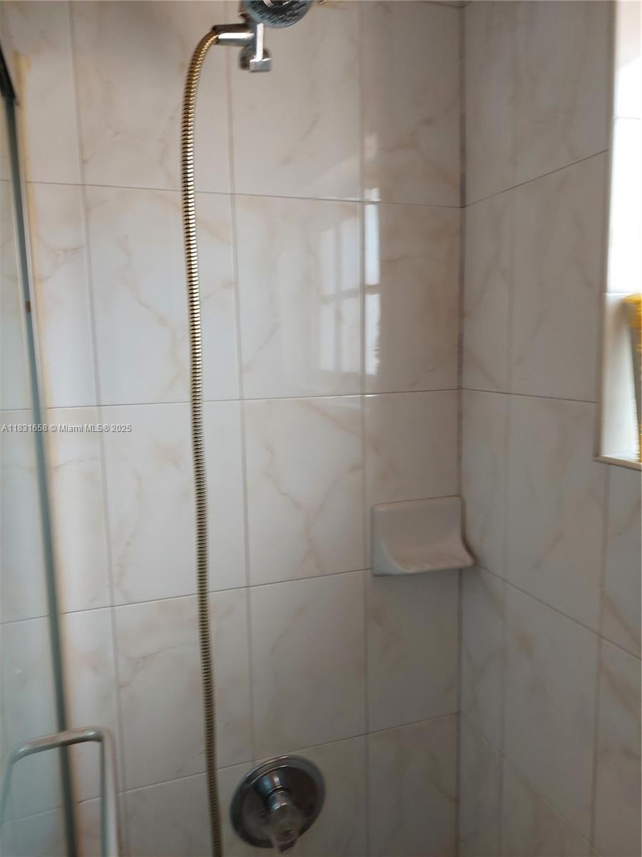 2403 West 76th Street, Unit 203 Hialeah, FL 33016 - Photo 8 of 13 a bathroom with a shower