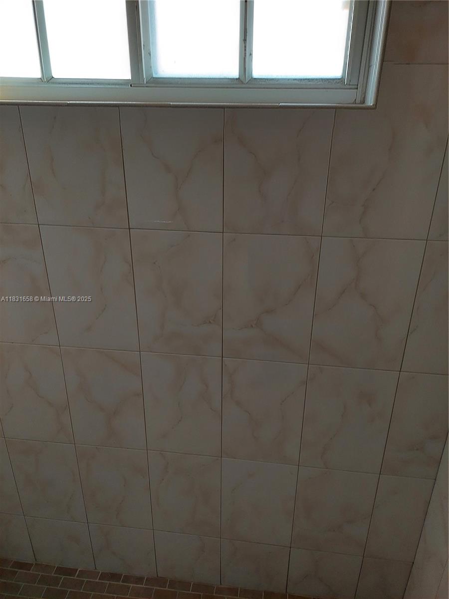 2403 West 76th Street, Unit 203 Hialeah, FL 33016 - Photo 10 of 13 a bathroom with a shower