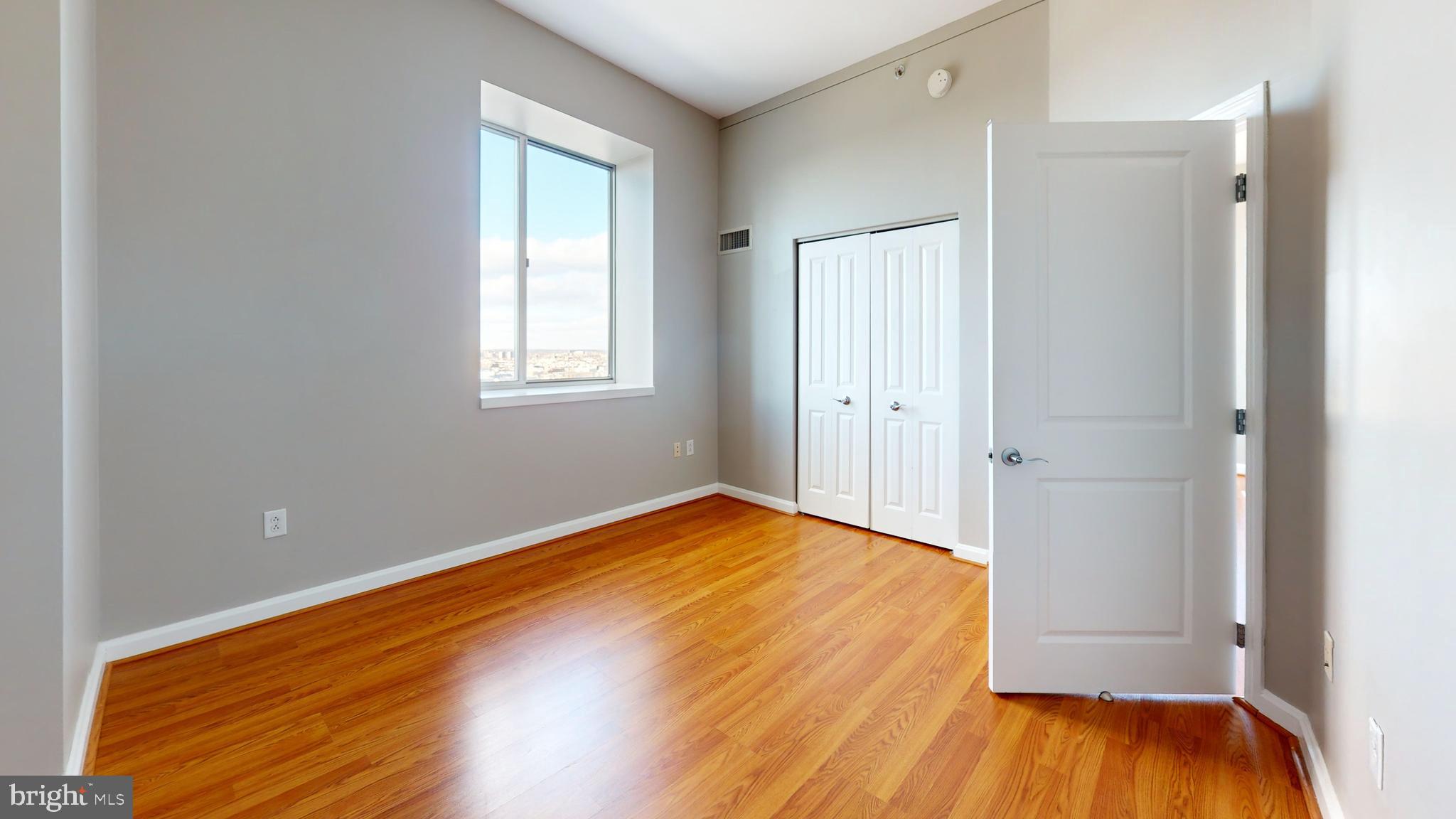 901 North Penn Street, Unit R2404 Philadelphia, PA 19123 - Photo 22 of 29 a view of empty room with wooden floor and fan