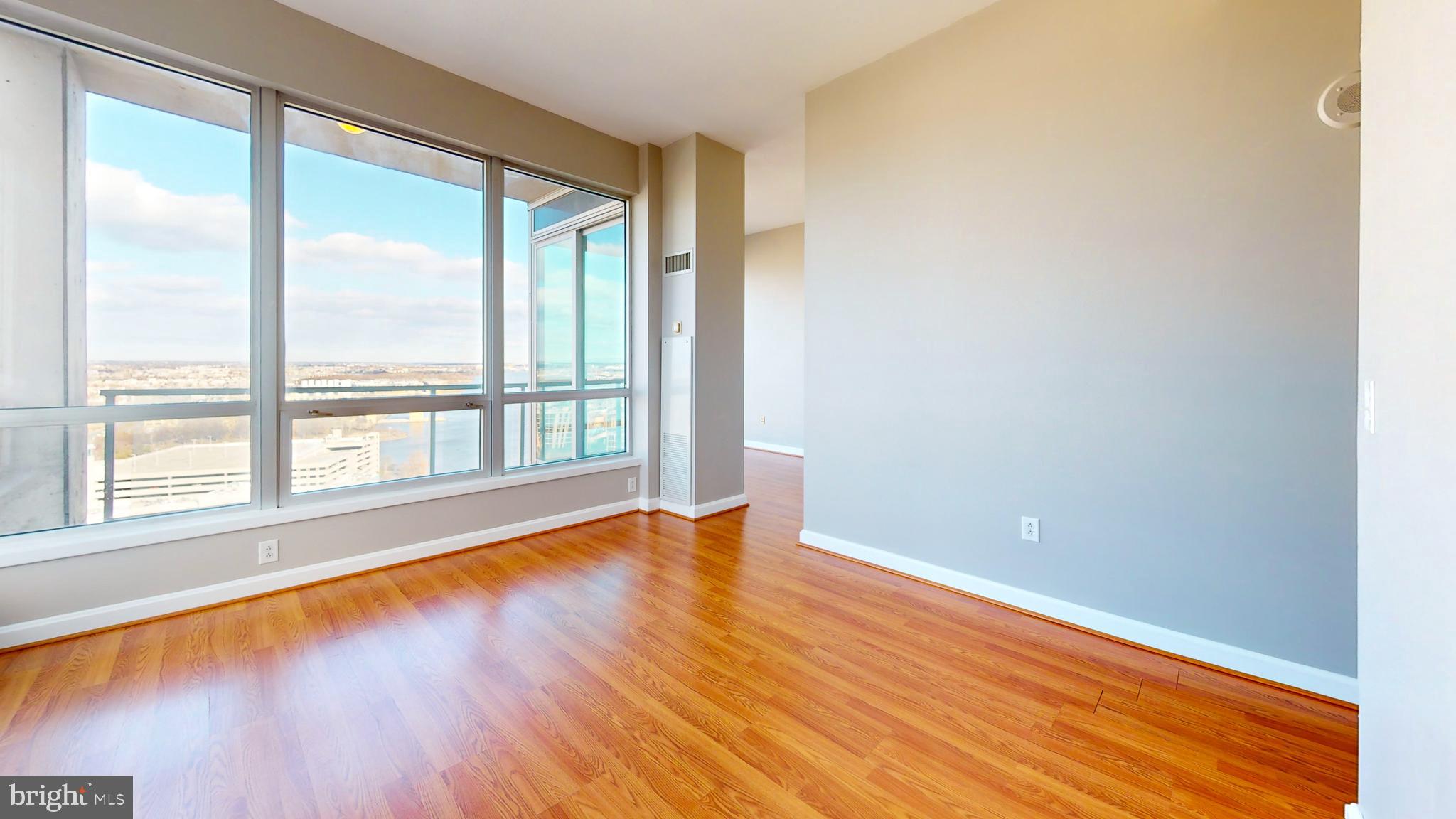 901 North Penn Street, Unit R2404 Philadelphia, PA 19123 - Photo 7 of 29 wooden floor in an empty room with a window